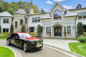 Image of house with car parked in front of it